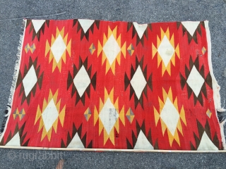 As found: Turn of the century transitional Navajo rug measuring 4'4"x 6'6" in need of service.  Ends need to be partially rewoven as well as some scattered area's in the field.  ...