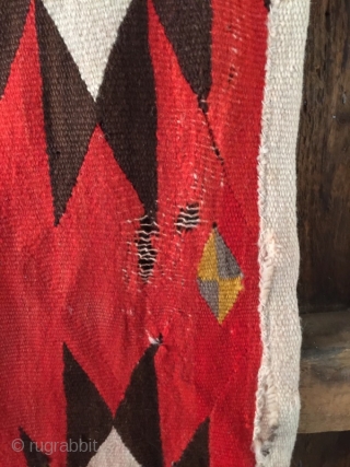 As found: Turn of the century transitional Navajo rug measuring 4'4"x 6'6" in need of service.  Ends need to be partially rewoven as well as some scattered area's in the field.  ...