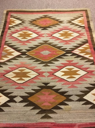 Nice older 1920's  Navajo with an 'A' side and a 'B' side measuring 56"x 71" ( couple inches wider from one end to the next), few stains, otherwise in good condition. 