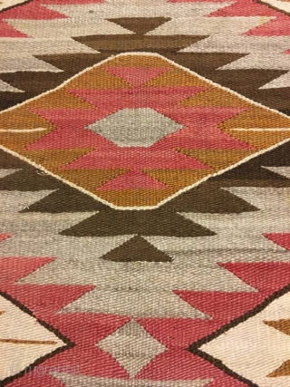 Nice older 1920's  Navajo with an 'A' side and a 'B' side measuring 56"x 71" ( couple inches wider from one end to the next), few stains, otherwise in good condition. 