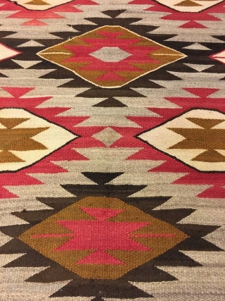 Nice older 1920's  Navajo with an 'A' side and a 'B' side measuring 56"x 71" ( couple inches wider from one end to the next), few stains, otherwise in good condition. 