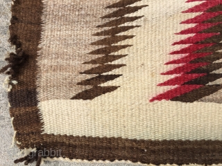 As found: Vintage Navajo rug measuring 3'5"x 5'8" with a stain of unknown substance in one of the ivory blocks in the middle of the rug.  Also a faint discoloration at  ...