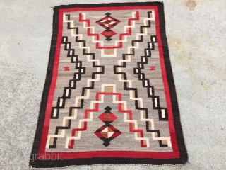 As found: A nice vintage mid century Navajo rug measuring 3'2" wide at one end, and 3'4" at the other end, and 4'8" long.  In pretty good shape except for a  ...