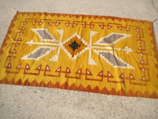 Fresh from an estate: an old Navajo measuring 37"x61" in good condition.  One picture is from one side, the other pic is from the other side      