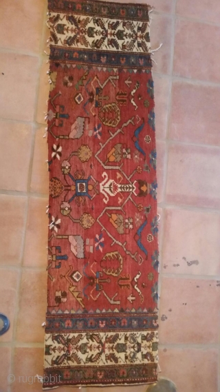Old NW Persian rug measuring 5'6"x 13'6" that has been reduced in size, the two roughly 1'x 5'6" pieces that were removed are available to put back in the rug.  Thanks  ...