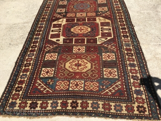 4’9”x 8’ with a wear spot, low even pile, pretty rug.                      