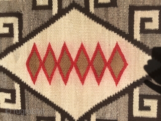 As found:  An interesting vintage Navajo Crystal rug measuring 3'5"x 5'4 with bleeding in the reds, a small hole, spots, fabric sewn on both ends, and needs binding reinforcement.  The  ...