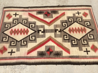 As found:  An interesting vintage Navajo Crystal rug measuring 3'5"x 5'4 with bleeding in the reds, a small hole, spots, fabric sewn on both ends, and needs binding reinforcement.  The  ...