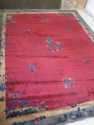 nice old Chinese carpet measuring 11'6"x 9'.  full pile.  has a couple of spots.                 