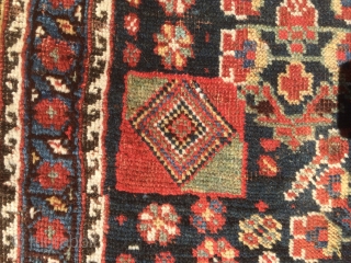 As found: 1900's to 1920's Persian Khamseh in good condition measuring 7'5"x 4'7", three inches difference in width from one end to the other (4'6" to 4'9"), pile is low and even,  ...