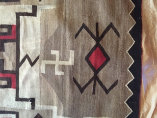 1920's-30's Navajo rug measuring 3'x 5' with a foots worth of reweaving that needs to be done on one end (maybe 2-4 rows of black border color), has a little notch on  ...