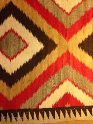 The Rug Pickers find as found: A vintage Navajo rug measuring 50"x 75", has two area's with holes, can E-mail more pics upon request.  All in all, nice colors, nice lay  ...