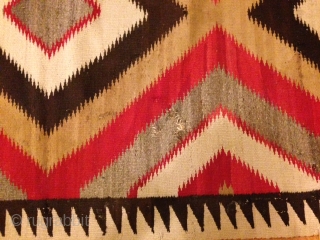 The Rug Pickers find as found: A vintage Navajo rug measuring 50"x 75", has two area's with holes, can E-mail more pics upon request.  All in all, nice colors, nice lay  ...