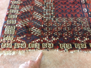 1890’s Tekke with loss at both ends and two small old repairs measuring 4’7”x 3’11”, thick pile, nice colors and design. Thanks           