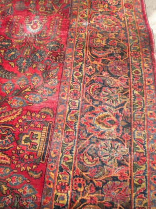 Fresh from an estate as found: A 1920's Persian sarouq, size is 11'10"x8'10".  It has good wool, good weave, good colors, but unfortunately, has wear almost down to the foundation in  ...