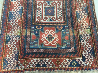 As found: Late 1800's Kazak measuring 3'9" to 4'1" wide by 7'5" long, has foundation showing, has four puckered wear area's, has minor loss of pile at one end, needs attention to  ...