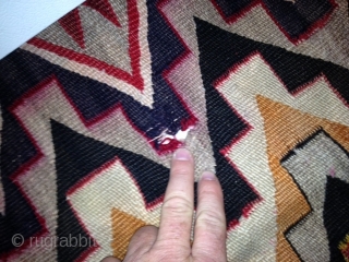 RUG-PICKERS FIND AS FOUND: AN OLD RED MESA NAVAJO WITH DAMAGE.  SOMEBODY IN THE PAST HAS TRIED TO SEW SOMETHING TOGETHER, HAS 7 HOLES ALONG ONE END, THE OTHER END JUST  ...