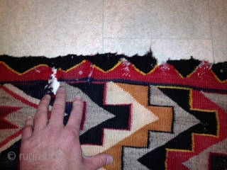 RUG-PICKERS FIND AS FOUND: AN OLD RED MESA NAVAJO WITH DAMAGE.  SOMEBODY IN THE PAST HAS TRIED TO SEW SOMETHING TOGETHER, HAS 7 HOLES ALONG ONE END, THE OTHER END JUST  ...