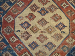 sweet little south Caucasian rug, good colors and some eccentric elements. damage to sides and bottom.                 