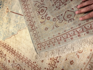 A TABRIZ SILK RUG.IN GOOD CONDITION AND PILE.                         