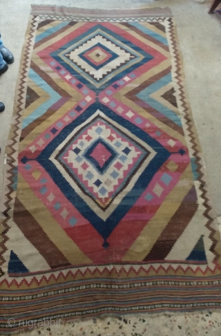 Antique Qashqai kilim. Some old restorations done on it and some other areas need more. Found as it is. Size: 137 cm x 270 cm.        
