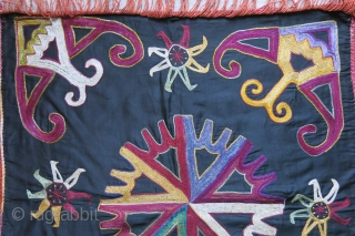 Uzbekistan Lakai - Kungrat tribal wall hanging. silk embroidery on fine cotton with dyed cotton tassles. Circa 1900 or ealier. size : 21" X 19.5" - 53 cm X 50 cm  