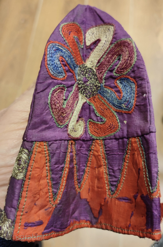 Antique Azerbaijan Silk on Silk Embroidered Childs Skullcap.

Some damages around it, l tried to show as much as possible on images.
Size: height 14.5cm and 41cm in circumference      