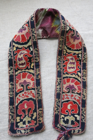 Uzbekistan Bokhara silk cross stitch embroidered belt, backing ikat has replaced with an old one. natural colors, no wool corrosion. circa 1900 or ealier - size : 30" X 3.5".   