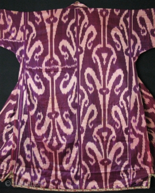 Tajikistan Khan Alas silk ikat chapan. Russian printed cotton lining. Circa 1900. Size: Arm to arm; 80" - 205 cm, Height; 56" - 143 cm, Armpit;33”- 84 cm and Skirt; 46"- 118  ...