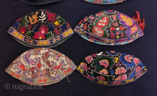 Group of Uzbekistan iroqi silk embroidered hats.