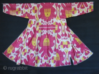 Uzbekistan – Bokhara antique Silk adras Ikat chapan. Saturated yellow and light cocheneal colors are used in a harmony. Lined with printed floral design cotton and cotton facing. It is in pretty  ...