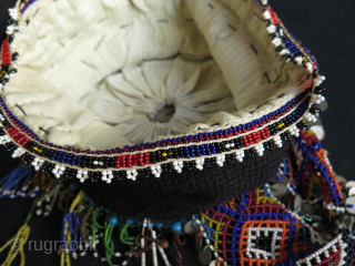 Turkish West Anatolian Bursa Traditional Woman's Beaded Hat. Used on ceremonial days.
In very good condition.

All glass beads except blue color large ones. Decorated with metal pieces.

Size: height 4.3" - 11cm and width  ...