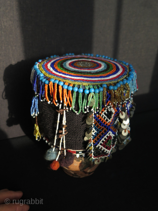 Turkish West Anatolian Bursa Traditional Woman's Beaded Hat. Used on ceremonial days.
In very good condition.

All glass beads except blue color large ones. Decorated with metal pieces.

Size: height 4.3" - 11cm and width  ...