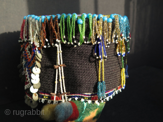 Turkish West Anatolian Bursa Traditional Woman's Beaded Hat. Used on ceremonial days.
In very good condition.

All glass beads except blue color large ones. Decorated with metal pieces.

Size: height 4.3" - 11cm and width  ...