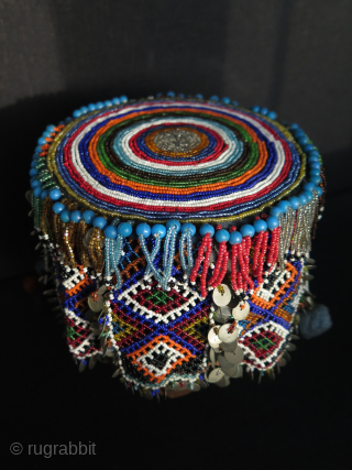 Turkish West Anatolian Bursa Traditional Woman's Beaded Hat. Used on ceremonial days.
In very good condition.

All glass beads except blue color large ones. Decorated with metal pieces.

Size: height 4.3" - 11cm and width  ...