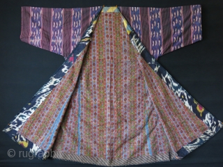 Tajikistan soft Shoi Ikat Chapan. Lined with printed Russian cotton and faced adras ikat. Indigo dyed lining inside of arms. A small pale stain on back side. Circa 1900 or earlier size:  ...