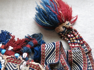 Southwest of Persia- Qashkai animal trapping- head wear. Cowry shells, buttons and other ornaments with tassels with an old Qashkai strap.            