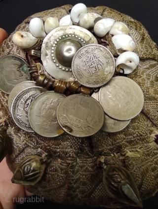 Afghan childs hat with coins.                            