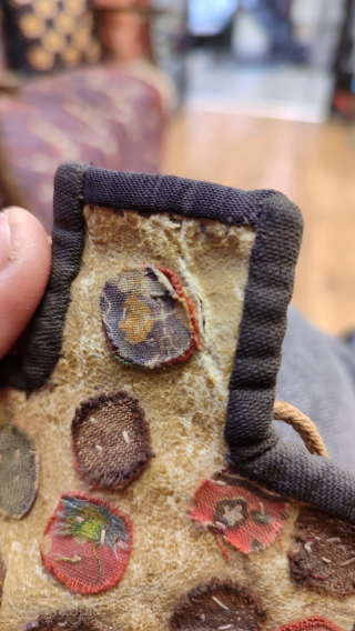 Antique Persian mini salt bag shape bag. It is made on an animal skin. One small tear on the top part.            