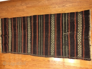 Antique Balouch Kilim with all good colors including generous amounts of aubergine. Old repairs and wear as seen in photos, otherwise in good condition.
Size: 7' X 2'8"/213 X 81cm. Washed. Buyer pays  ...