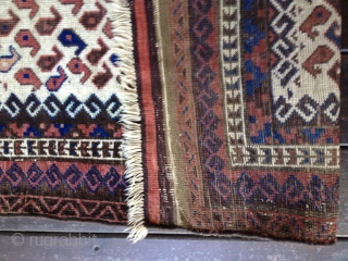 Early Baluch rug, probably from 3rd Qtr 19th Century or earlier. Unusual white field background filled with tiny botehs. Soft thin floppy handle. Low pile throughout and some oxidation of browns. Exhibits  ...