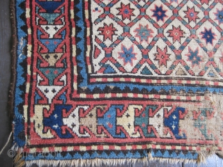 Star Lattice Kazak, probably from third quarter 19th C. Great colors on white field. Areas of serious wear alternating with portions of good pile. Selvedges not original. Soft floppy handle. A good  ...