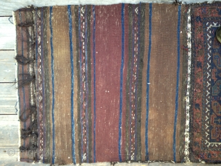 Early Antique Baluch Bag. Complete, with good colors including outstanding blues. Archaic and unusual design. Low pile with some oxidation and some fraying on sides and ends. Nice striped kilim open back.  ...