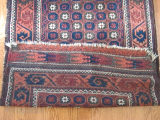 Late 19th C. Baluch rug with unusual star/lattice field design and curled-leaf border. Good pile in borders but lower in field. One old repair can be seen in second image. Good natural  ...