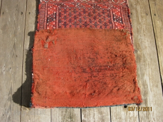 Antique Yomud sumac double bag, ca 1900. Complete with kilim backing. Good condition and with fastening loops intact. 42 X 20 in./107 X 51 cm. All natural dyes. Washed.     ...