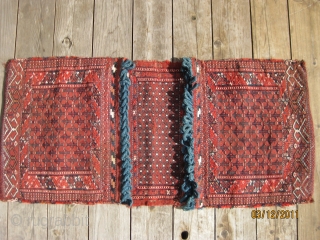 Antique Yomud sumac double bag, ca 1900. Complete with kilim backing. Good condition and with fastening loops intact. 42 X 20 in./107 X 51 cm. All natural dyes. Washed.     ...