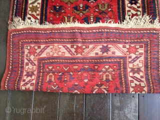 Antique Kuba rug, dated 1314/1896-7. All organic colors. Wonderful well-balanced palette with small tulips in an insect red field. Some limited areas of low pile and wear, otherwise good low to medium  ...