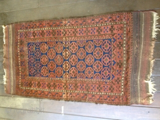 Baluch rug, ca 1900. Retains original length kilim ends with only slight damage. Medium pile throughout with one tiny hole and one spot of fold wear easily repaired. an abrash seen in  ...