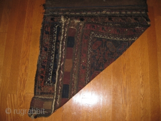 19th C. Belouch Bagface with good medium soft pile. Outstanding blues. Some oxidation of brown. Complete, striped kilim backing attached. Archaic design. Size 28 X 27 inches when closed. Retains a few  ...