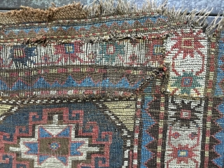 Antique Moghan Kazak Fragment. Cut and shut and both ends then sewn together and with a large patch and a 4"slit. Some good pile but overall rough condition.
Probably late 19thC and with  ...